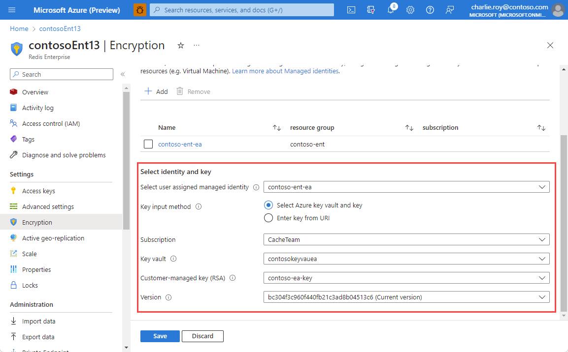 Screenshot of the identity and customer-managed key fields completed on the Encryption settings page for an existing cache.