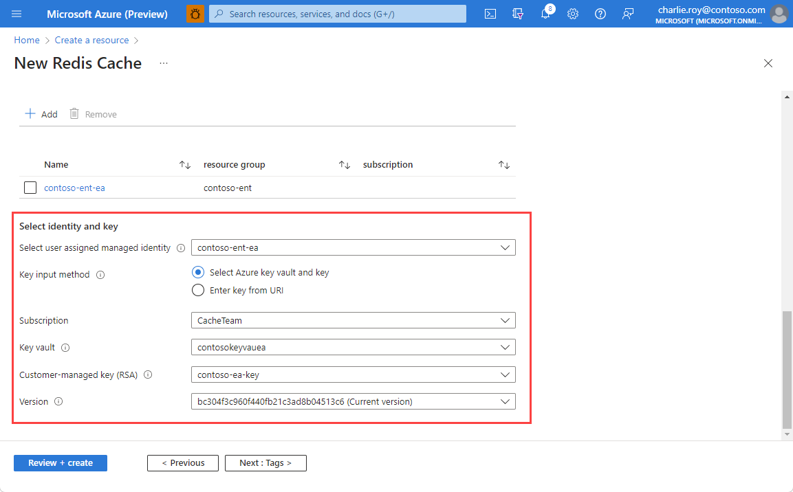 Screenshot of the identity and customer-managed key version fields completed for disk encryption configuration.