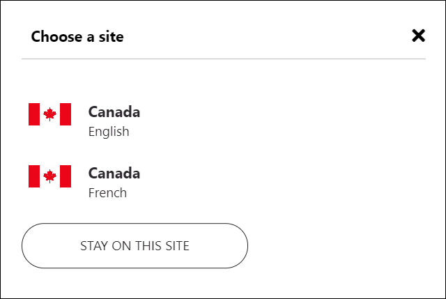カナダの英語とフランス語のサイトのオプションを示す地域/言語選択ダイアログ ボックスのスクリーンショット。